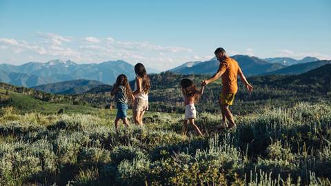 Family of four hiking at Deer Valley during the summer.