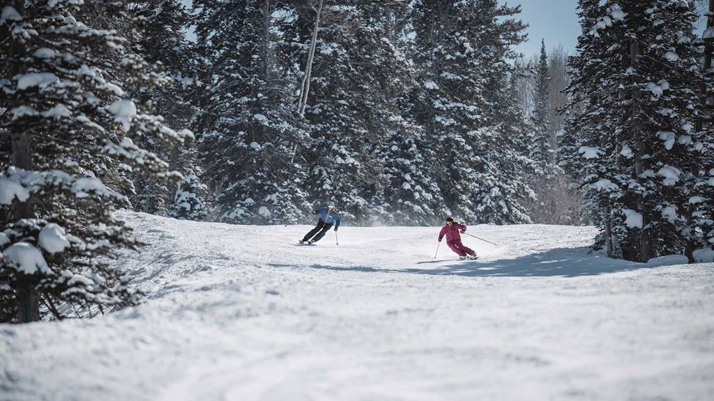 Man and woman skiing together at Deer Valley.