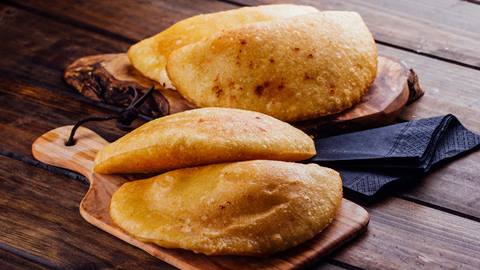 Four empanadas plated.