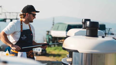 Chef making pizza in Gozney pizza oven at Deer Valley Resort.
