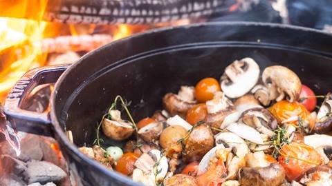 Vegetables cooking over fire