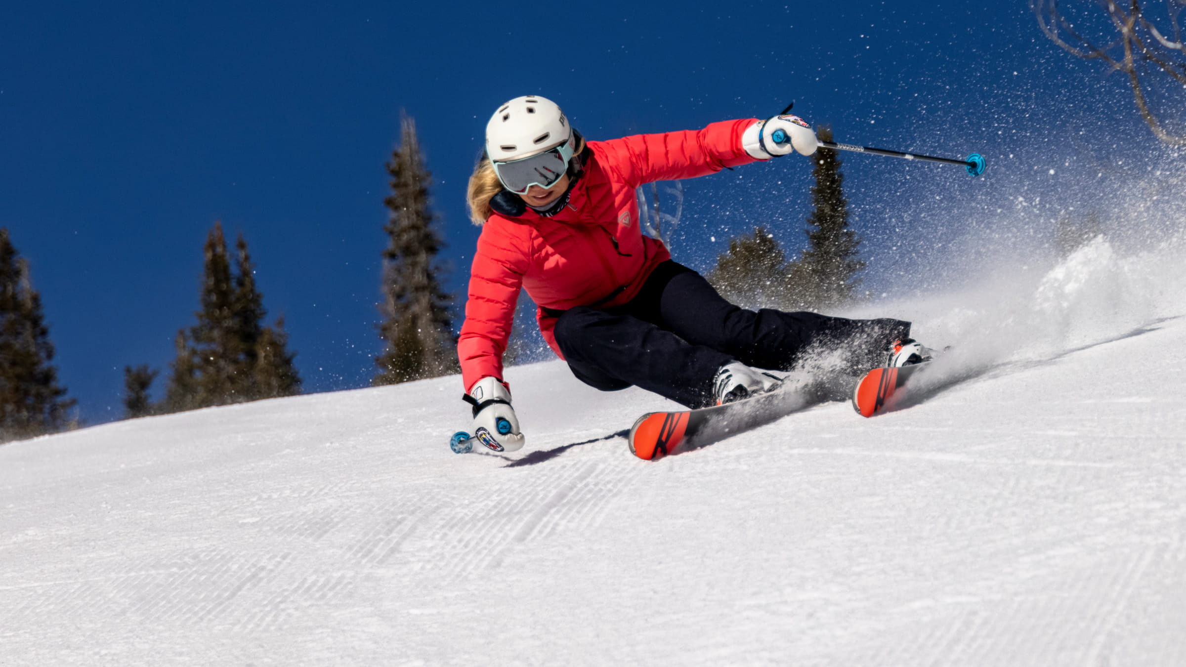 Jillian Vogtli skiing at Deer Valley on a bluebird day.