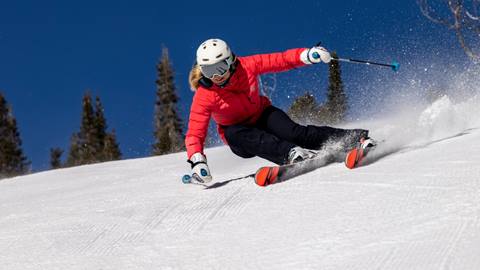 Jillian Vogtli skiing at Deer Valley on a bluebird day.