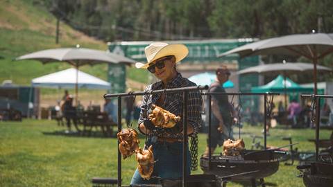 Chef live cooking chicken on Deer Valley's Silver Lake Lawn event in the summer.