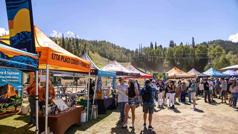 People exploring beer tents Deer Valley Mountain Beer Festival in Park City, Utah.