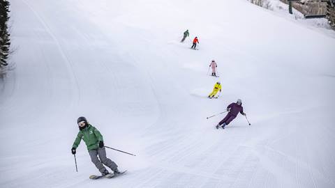 Deer Valley Mountain Host Tour skiing together.
