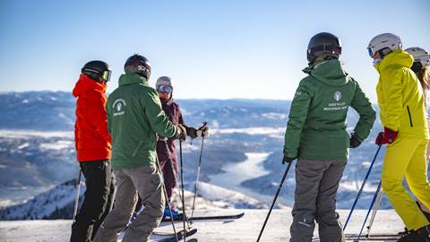 Deer Valley Mountain Hosts leading skiers on a Mountain Host Tour.