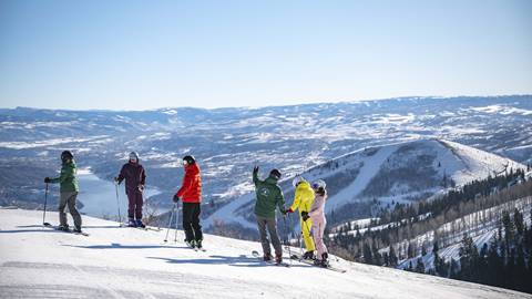 Deer Valley Mountain Hosts giving skiers a tour.