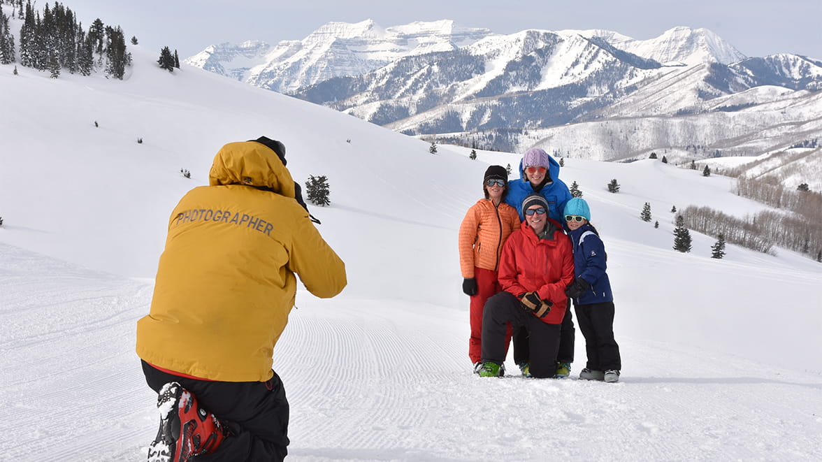 A photographer taking a photo of a family