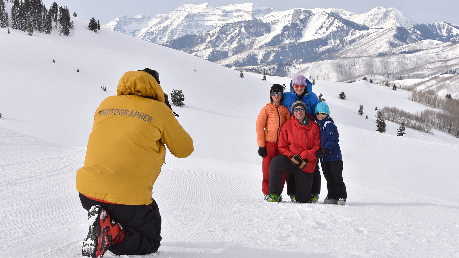 A photographer taking a photo of a family