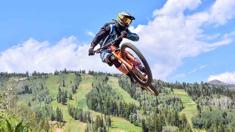 Mountain biker doing a trick at Deer Valley Resort in Park City, Utah. Taken by Mountain Ridge Photography.