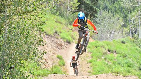 Two mountain bikers on trail at Deer Valley Resort in Park City, Utah. Taken by Mountain Ridge Photography.