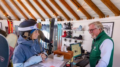 Deer Valley staff helping a guest with demo skis at the Rossignol High Performance Test Center.