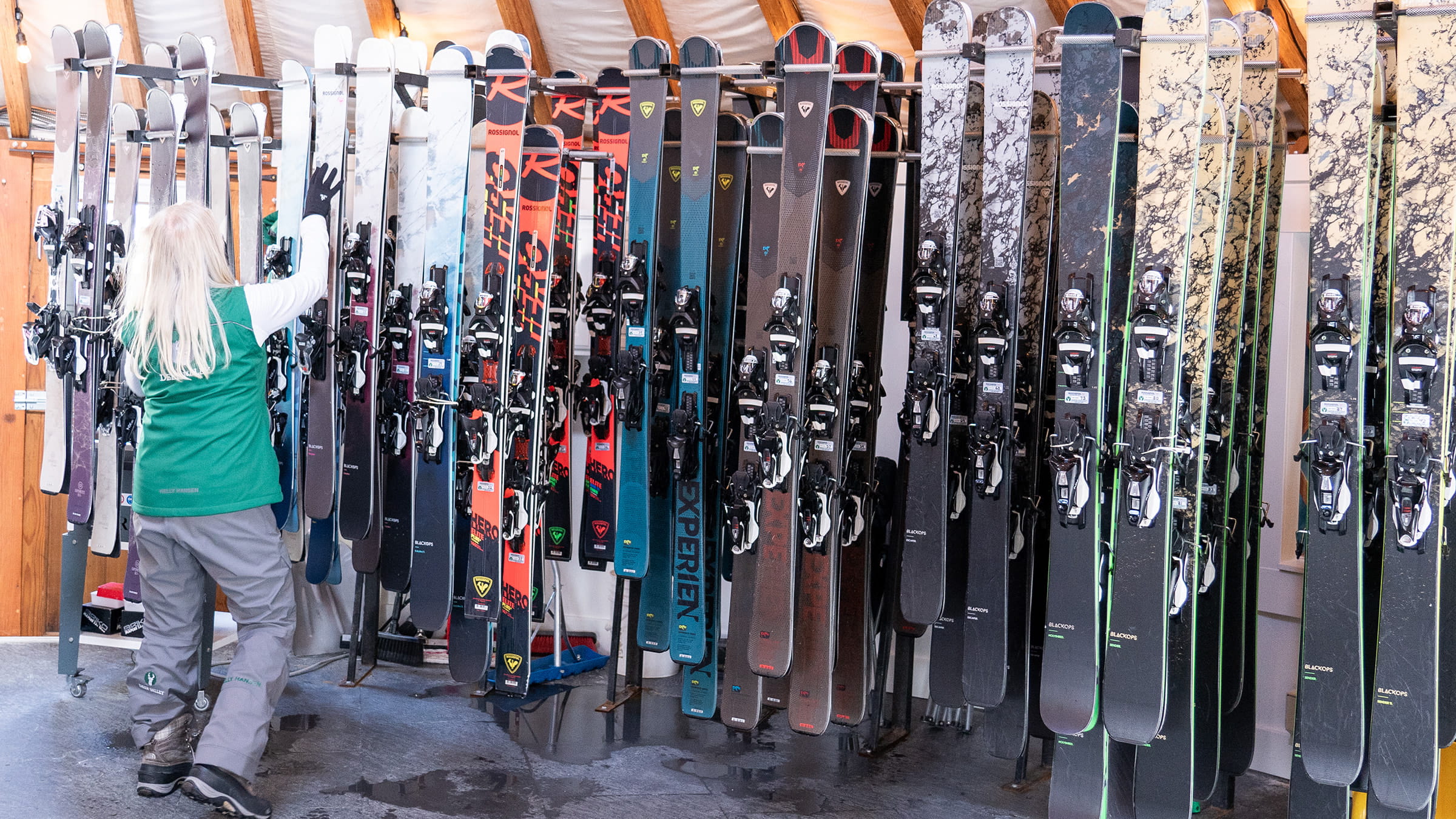 Deer Valley staff member standing by Rossignol high performance skis.