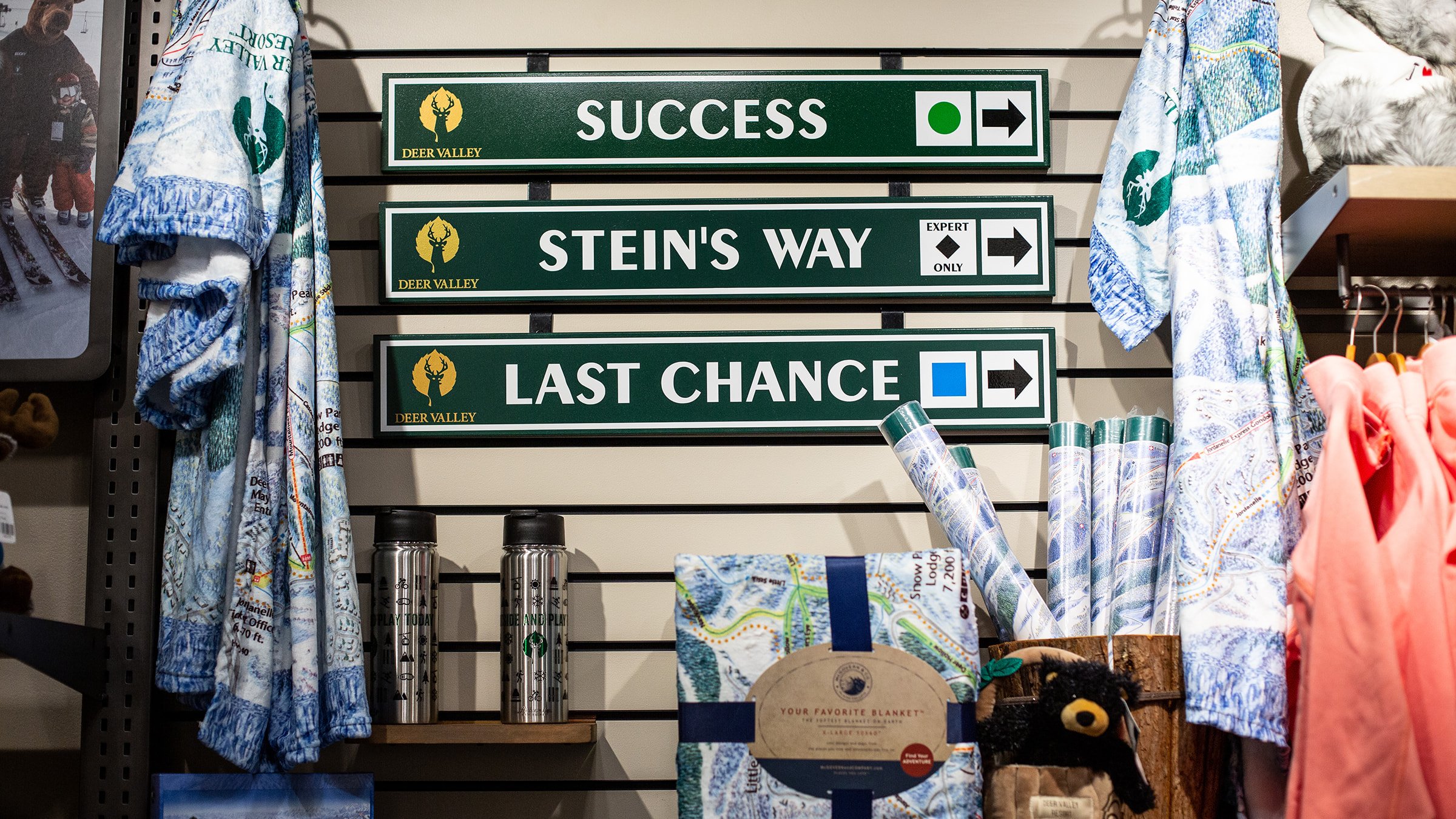 Deer Valley Signatures trail signs displayed on wall.