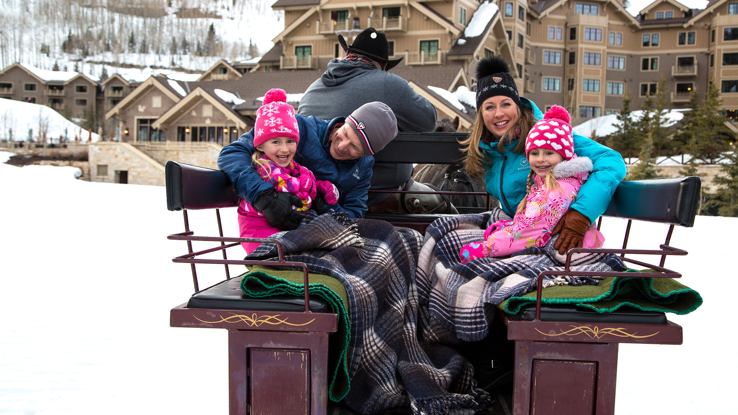 Family sitting in sleigh