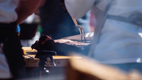 Chef slicing meat.