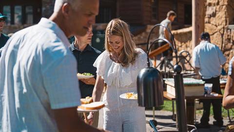 Guests serving themselves at food station at Deer Valley.