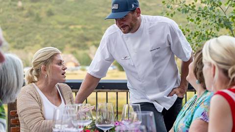 Deer Valley guests talking to Chef Clement Gelas.