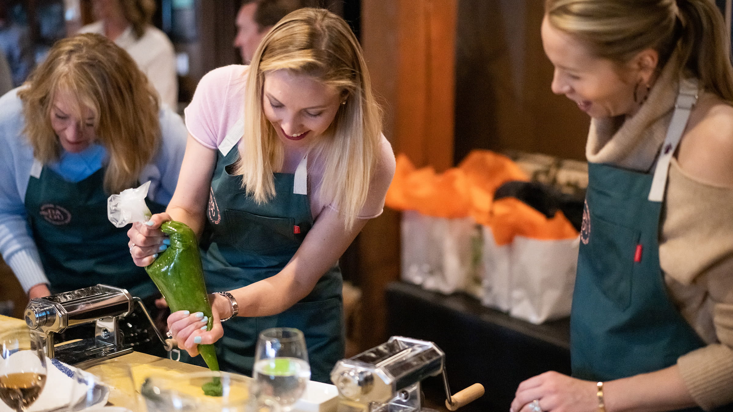 Two woman chatting while cooking together.