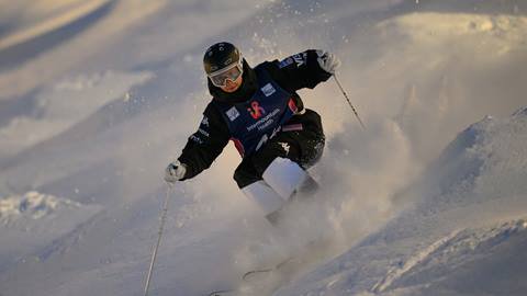 Competitor skiing moguls at Intermountain Health Freestyle Ski World 