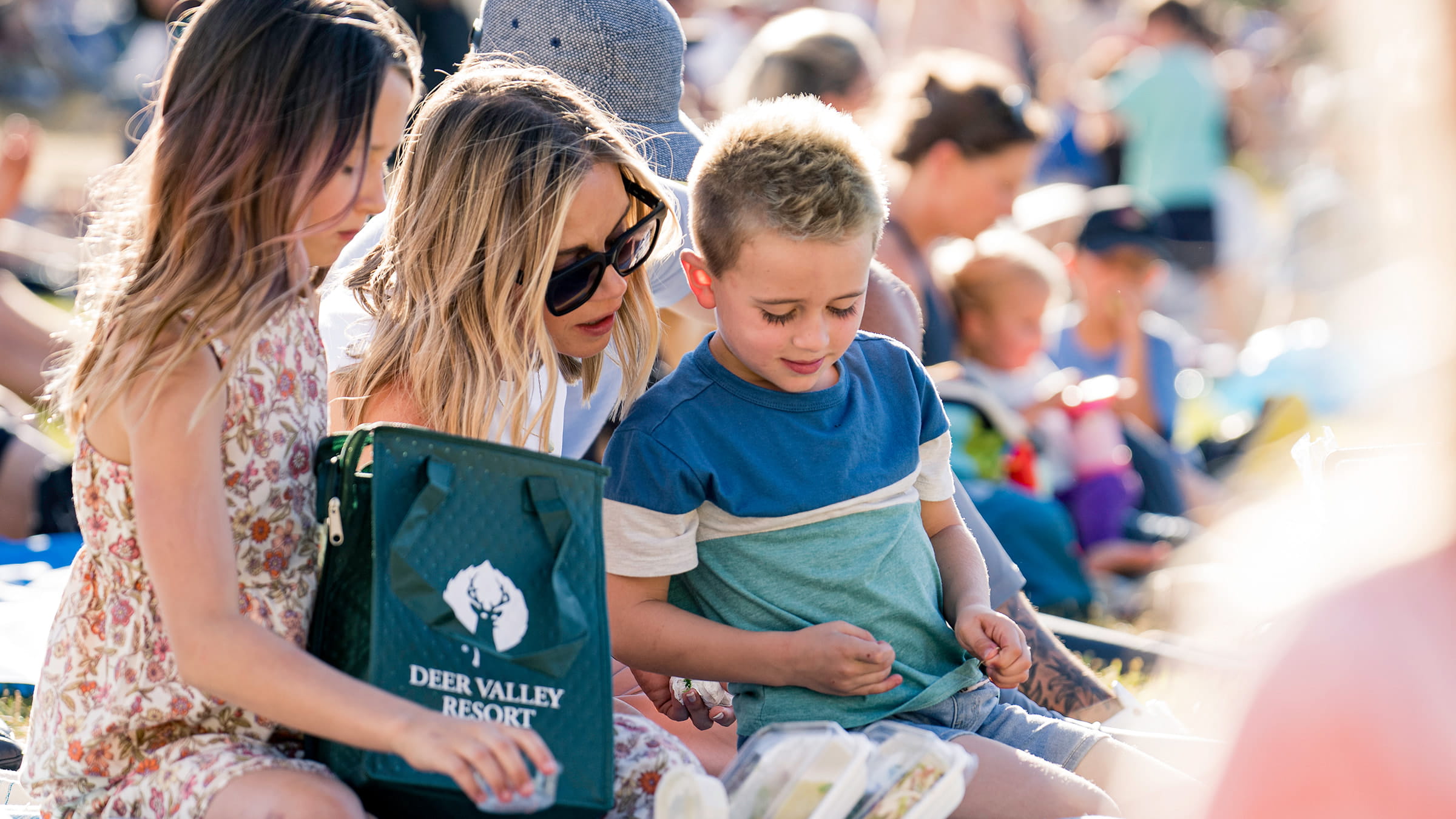 Mom and kids attending a Deer Valley summer concert.
