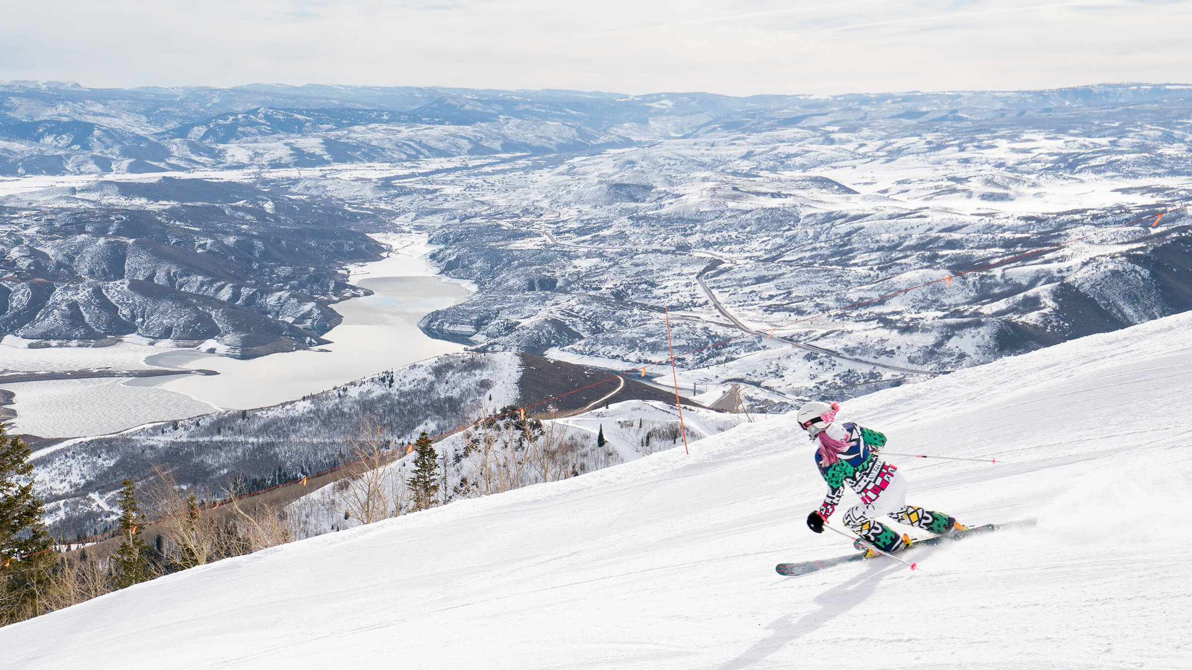 Female skier on groomed run.