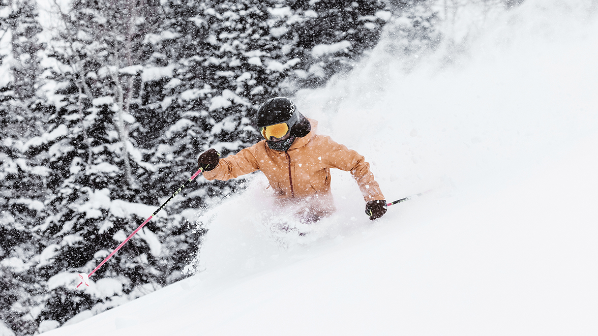 Skier skiing through powder at Deer Valley Resort