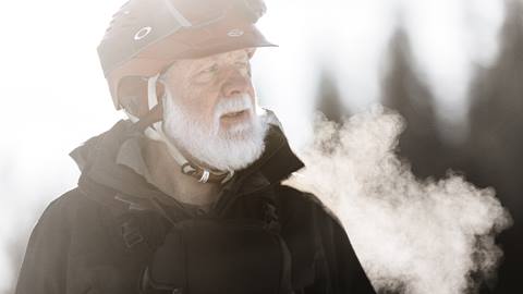 Brad Lewis, a volcano photographer, looking off into the distance on a cold winter morning