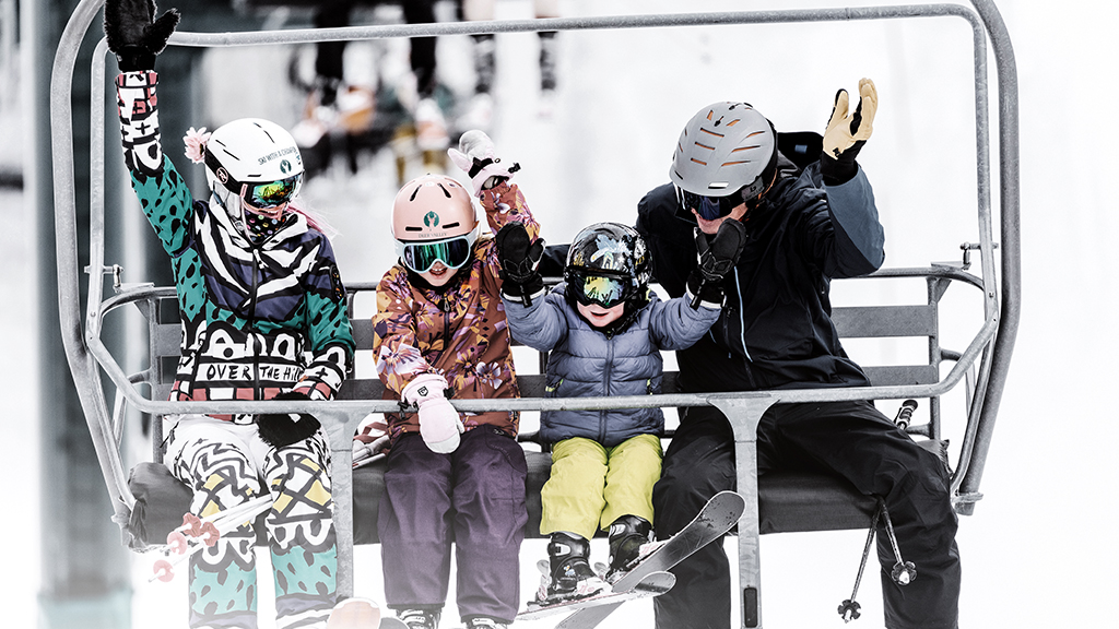 Instructor with students on chairlift
