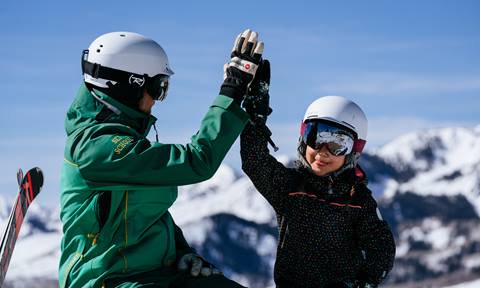 Ski school instructor teaching a lesson at Deer Valley Resort
