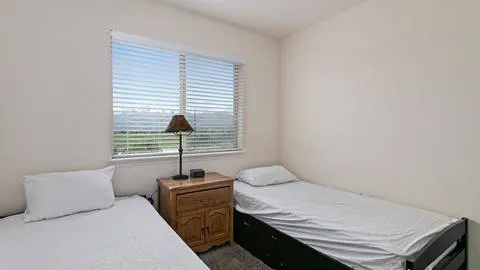 Image of bedroom in Wasatch Commons employee housing.
