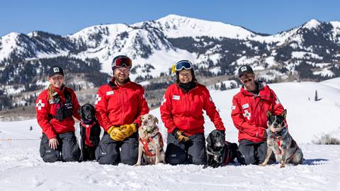 Deer Valley Ski Patrol team photo with avalanche rescue dogs