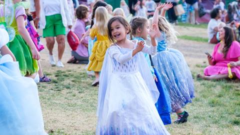 Young girl dancing at Disney in Concert show at Deer Valley.