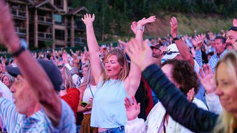 Deer Valley concert goers dancing to The Music of Paul Simon.