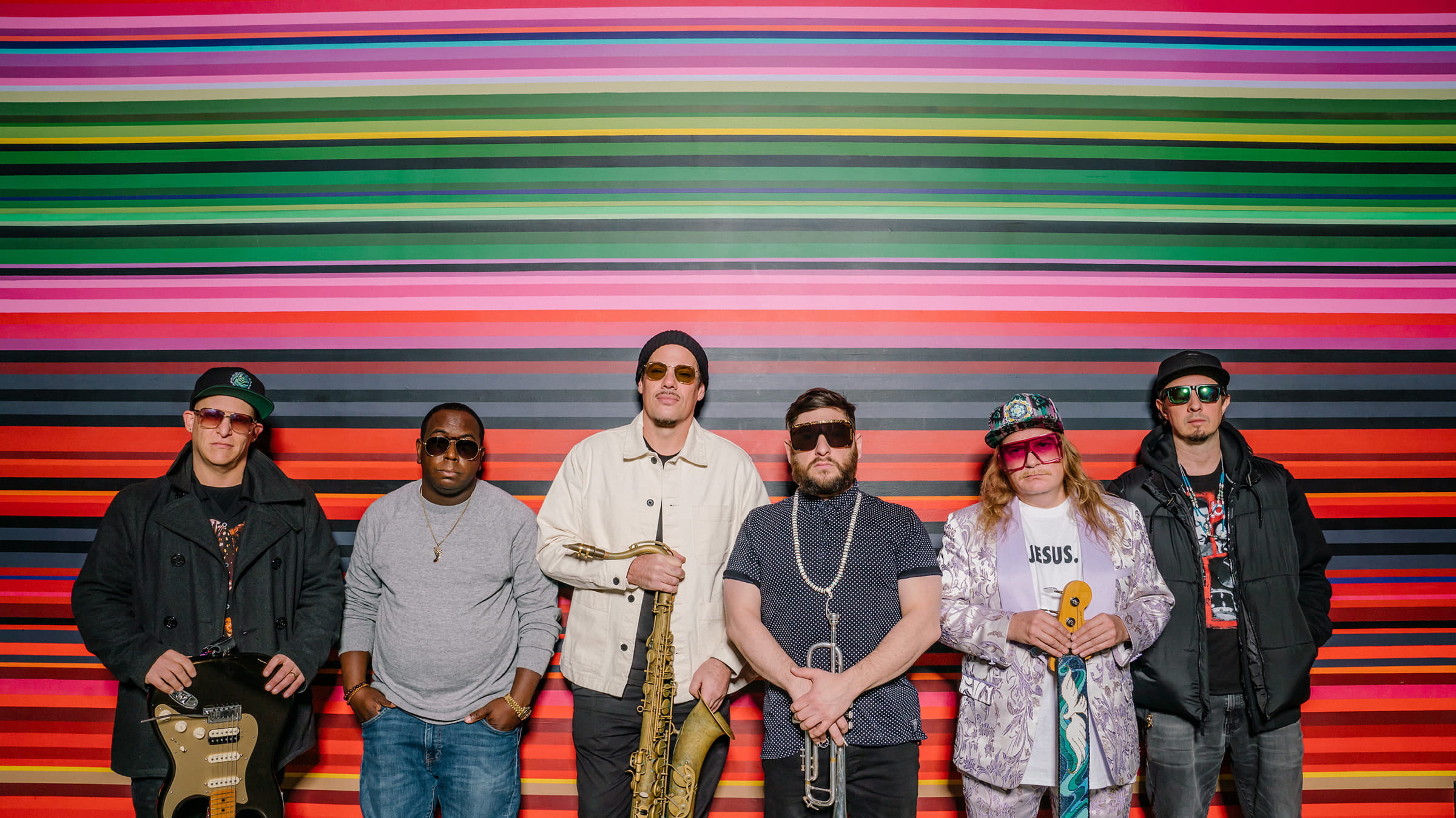 Band, Lettuce, posing against a colorful background for cover of promotional material