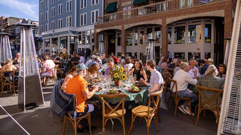 Groups of people enjoying lunch during the Savor the Summit event in Park City, Utah.