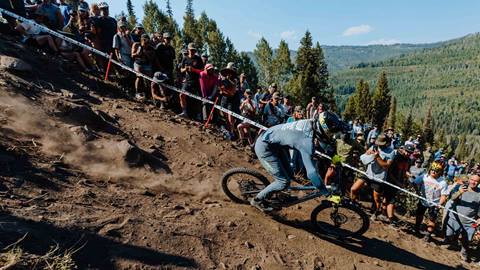 Spectators watching downhill mountain biker compete at the US Open for Mountain Biking
