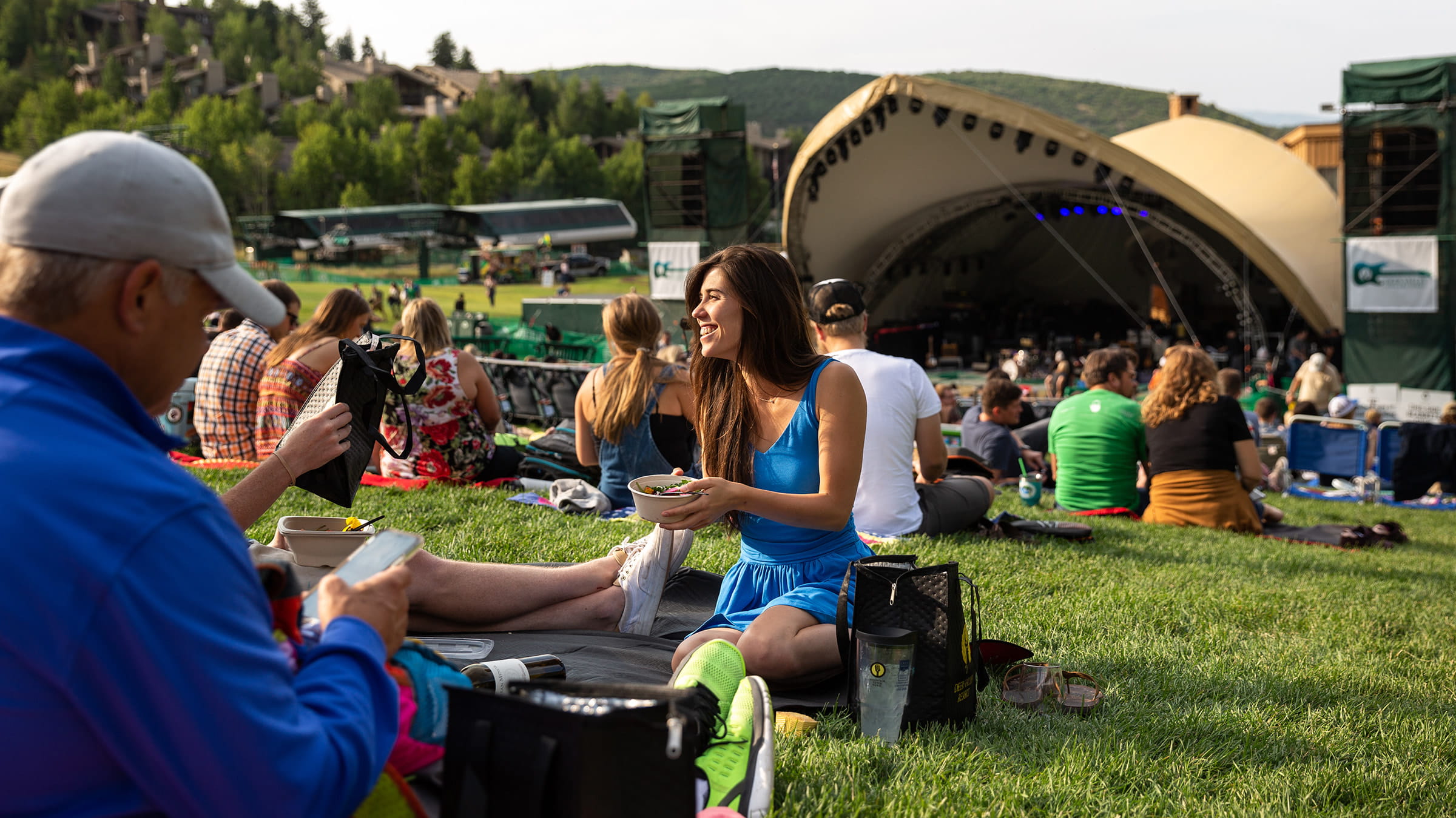 Guests eating dinner while waiting for a summer concert at the Deer Valley Outdoor Amphitheater.