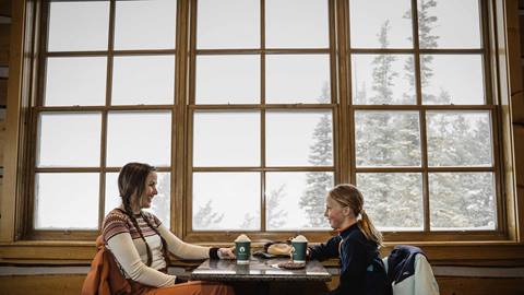 Mother and daughter inside Cushing's Cabin at Deer Valley.