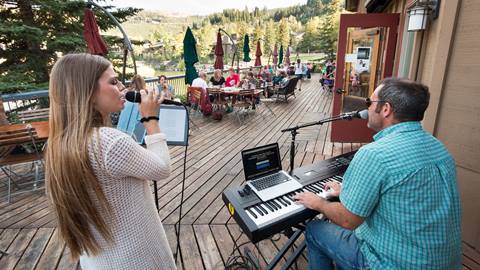 Guests enjoying summer concert on the deck at Deer Valley Cafe.