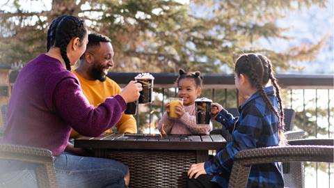 Family eating on the Deer Valley Café deck.