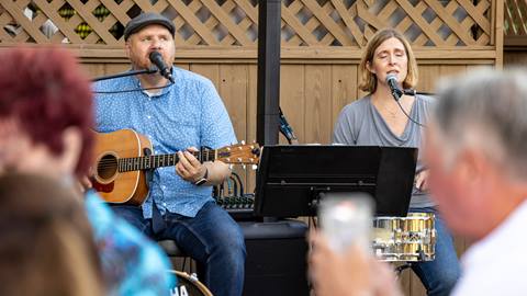 Two musicians performing at Deer Valley Café.