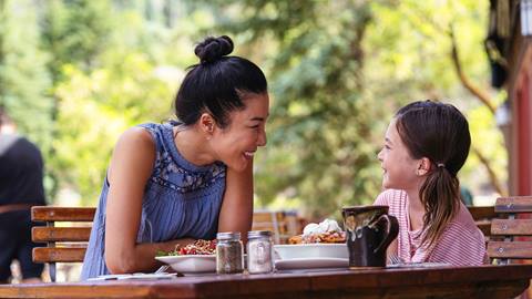 Mom and daughter having lunch on the deck at Deer Valley Café.