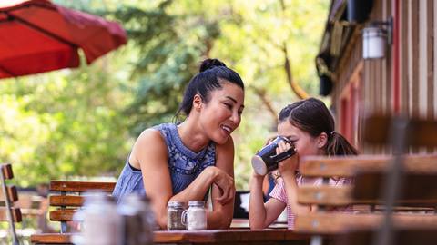Mom and daughter having lunch on the deck at Deer Valley Café.