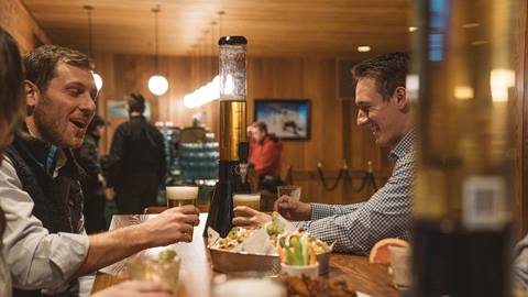 Friends drinking at Edgar's après-ski bar in Deer Valley.