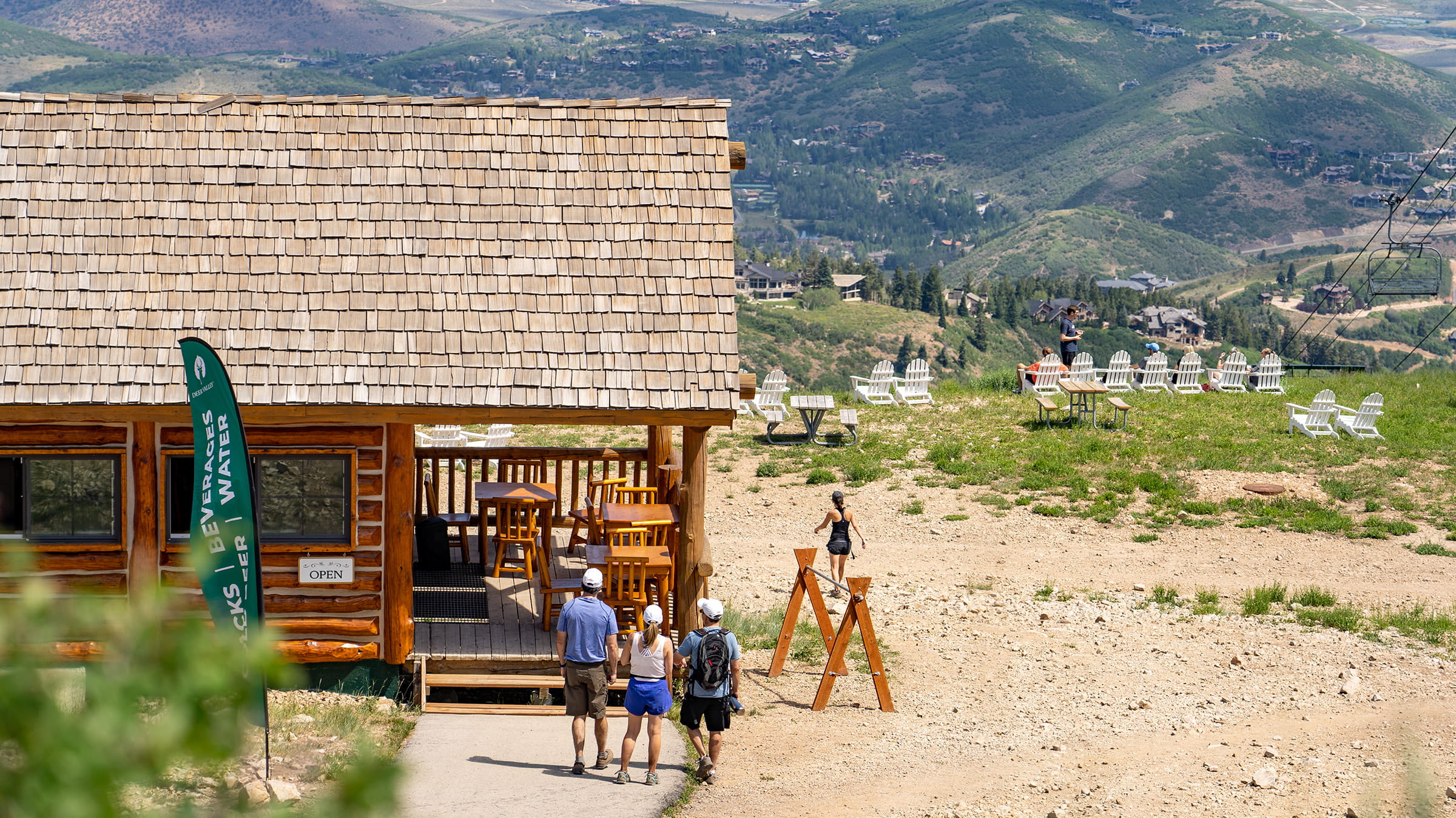Guests walking to listen to Mountaintop Brews and Tunes summer après at Deer Valley Resort.