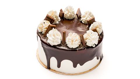 Chocolate cake with whipped cream and choclate sauce