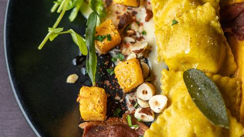 Ravioli served with a salad.