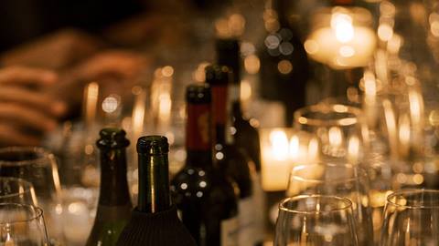 Wine and glasses on a table at a Taste of Luxury event.